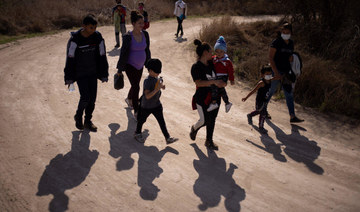 US detained nearly 100,000 migrants at Mexico border in February, sources say