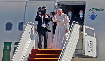 Pope Francis bows in farewell to his hosts before boarding his Alitalia Airbus A330 aircraft as he departs from the Iraqi capital's Baghdad International Airport on March 8, 2021. (AFP)