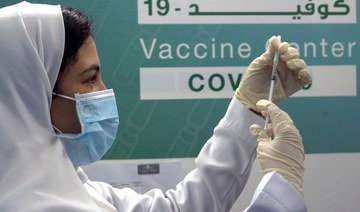 Saudi physician Hala Al-Kattan prepares to inject a Pfizer vaccine at a new coronavirus vaccination center at Jeddah’s old airport, Saudi Arabia. (File/AP)