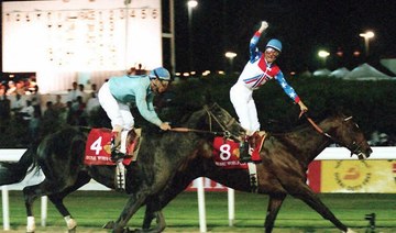 US jockey Jerry Bailey (R) riding "Cigar" celebrates on the finish line 27 March 1996 in Dubai after winning the Dubai World Cup. (AFP/File Photo)