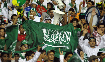Saudi fans cheers their team on against Vietnam during a men's football qualifying match for the Beijing 2008 Olympics in Dammam. (AFP/File Photo)