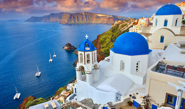 The picture-perfect island of Santorini, with its proliferation of blue-domed buildings, is a honeymooners’ favorite. (Shutterstock)