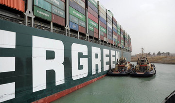 Suez dredgers step up efforts to free giant cargo ship