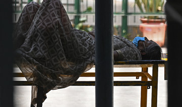 A Covid-19 coronavirus patient lies on a stretcher outside a hospital in New Delhi on April 24, 2021. (AFP)