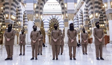 Military-trained Saudi women guards guide Umrah pilgrims in Makkah in Ramadan