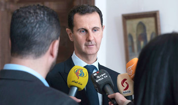 Assad grants amnesties before election