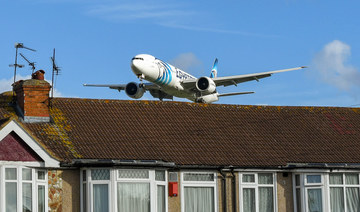 Egyptair Boeing 777 jet flying low over rooftops to land at London Heathrow Airport. (Shutterstock/File Photo)