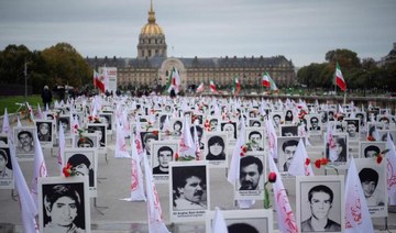 The 1988 executions of thousands of Iranian political prisoners were commemorated by representatives of the People's Mujahedin of Iran in France in 2019. (AFP/File Photo)