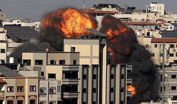 A picture shows the explosion after an Israeli strike targeted a building in Gaza City on May 14, 2021. Israel pounded Gaza and deployed extra troops to the border as Palestinians fired barrages of rockets back. (AFP)