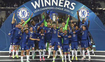 Chelsea's team captain Cesar Azpilicueta lifts the trophy at the end of the Champions League final soccer match between Manchester City and Chelsea at the Dragao Stadium in Porto, Portugal, Saturday, May 29, 2021. (AP)