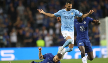 Manchester City's Algerian midfielder Riyad Mahrez (C) jumps over Chelsea's Mateo Kovacic (L) as defender Antonio Ruediger (R) chases them during the UEFA Champions League final. (AFP)