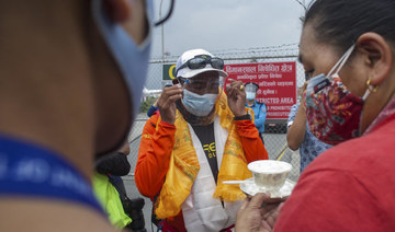 Everest climbers struggle to return home amid Nepal COVID-19 travel curbs