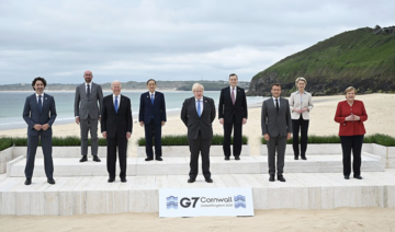 British Prime Minister Boris Johnson greeted world leaders on a wooden boardwalk atop the freshly raked sand of Carbis Bay to open the Group of Seven summit Friday. (AP)