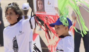 Gaza children fly kites with portraits of kids killed in last conflict with Israel