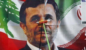 Ahmadinejad leads boycott of  ‘sham’ and subdued Iran vote