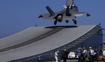 An F-35 aircraft takes off from the UK's aircraft carrier HMS Queen Elizabeth in the Mediterranean Sea on June 20, 2021. (AP Photo/Petros Karadjias)