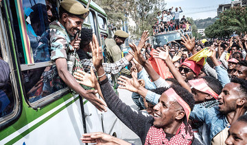 People try to shake hands with soldiers of Tigray Defense Force as they arrive in Mekele, the capital of Tigray region, Ethiopia. The rebel fighters have vowed to drive all ‘enemies’ out of the region. (AFP)