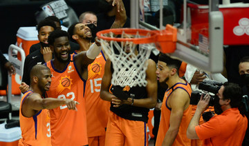 The Phoenix Suns team celebrate after a 130-103 final game victory against the Los Angeles Clippers on June 30, 2021. (Gary A. Vasquez-USA TODAY Sports)