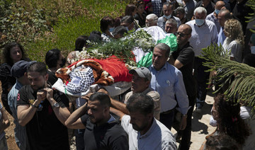 Thousands mourn daughter of jailed Palestinian activist