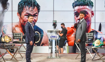 Manny Pacquiao, left, and Errol Spence Jr. attend a news conference at the Fox Studios lot in Los Angeles ahead of their upcoming boxing match, taking place in Las Vegas on Aug. 21, in Los Angeles, Sunday, July 11, 2021. (AP)