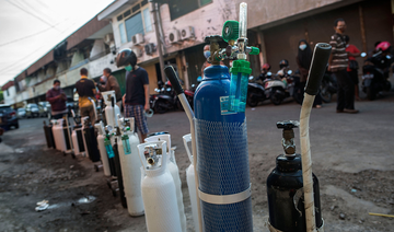 Indonesians scramble for oxygen as COVID-19 cases hit record highs