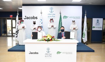 SGP CEO Edward Tah, front right, and Jacobs Business Development Director Omar Al-Zahrani, front left, signed the agreement in the presence of SGP Chairman Abdullah Al-Zamil. (Supplied)