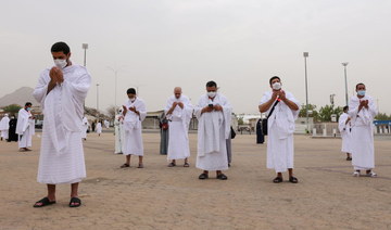 Masked Hajj pilgrims on Mount Arafat pray for COVID-free world