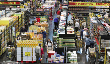 People shop at a supermarket as they begin to stock up on provisions, in Beirut, Lebanon. (AP file photo)