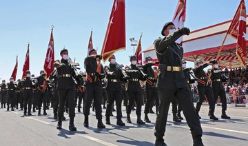 Turkish soldiers take part in a parade in the northern part of Cyprus' divided capital Nicosia, in the self-declared Turkish Republic of Northern Cyprus on July 20, 2021. (AFP)