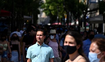 As cases soar, Spaniards keep their masks firmly on