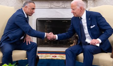 US President Joe Biden shakes hands with Iraqi Prime Minister Mustafa Al-Kadhimi (L) in the Oval Office of the White House in Washington, DC, July 26, 2021. (AFP)