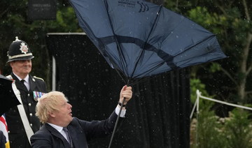 UK PM Johnson’s umbrella mishap amuses Prince Charles