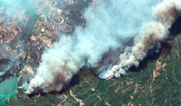 In this image provided by Maxar, a satellite view of smoke rising from wildfires near Oymapinar Dam, southern Turkey, on Thursday July 29, 2021. (AP)