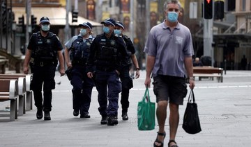 COVID-19 cases surge in Sydney as police cordon deters protest