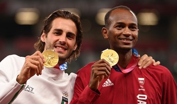 Gianmarco Tamberi has expressed his joy at sharing an Olympic high jump gold medal with his friend from Qatar Mutaz Essa Barshim. (AFP)