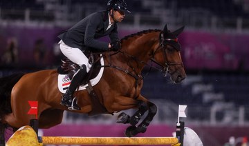 Egypt's Nayel Nassar rides Igor van de Wittemoere in the equestrian's jumping individual qualifying during the Tokyo 2020 Olympic Games at the Equestrian Park in Tokyo on August 3, 2021. (AFP)