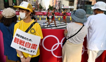 Tokyo logs record 5,042 cases as infections surge amid Olympics