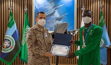 Commander of the Royal Saudi Air Force Lt. Gen. Turki bin Bandar bin Abdul Aziz honors Olympic medalist Tarek Hamdi. (Twitter/@modgovksa)