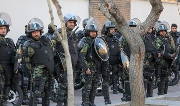 Iranian security forces standing guard in Tehran. Amnesty International has said security personnel used “unlawful force.” (AFP/File Photo)