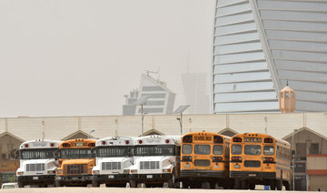  A picture taken March 18, 2020 shows school buses parked in an open area after closure of schools in Riyadh amid measures to combat the novel COVID-19 coronavirus disease. (AFP)