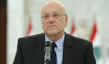 Lebanon's premier-designate Najib Mikati holding a press conference following his meeting with the president at the presidential palace in Baabda, east of the capital Beirut, on August 16 26, 2021. (AFP)