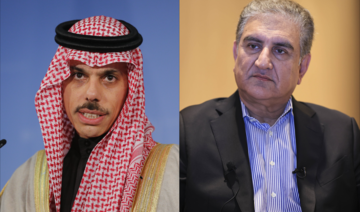 Saudi Foreign Minister Prince Faisal Bin Farhan (L) receives phone call from Pakistan’s Foreign Minister Shah Mahmood Qureshi. (File/Anadolu Agency via Getty Images)