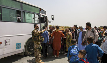 German soldiers process evacuees at Hamid Karzai International Airport in Kabul, Afghanistan, on Aug. 28, 2021. (US Marine Corps photo via AP)