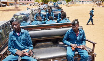 SSNPS (South Sudan National Police Service) police officers sit on the back of a pickup truck while they gather ahead of patrolling the streets of Juba, South Sudan. (AFP)