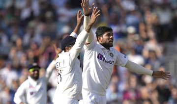 India's Umesh Yadav celebrates as he takes the wicket of England's James Anderson, meaning India win by 157 runs on day five of the fourth Test match at The Oval. (AP)