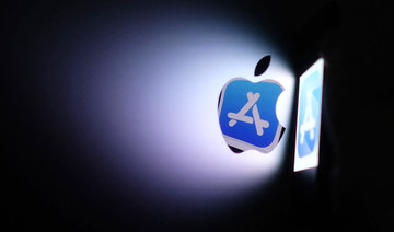 This file illustration photo shows the Apple app store logo reflected from an iPhone onto the back of an iMac in Los Angeles, August 26, 2021. (AFP)