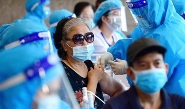 Vietnam’s biggest city to keep coronavirus curbs, flight resumption sought
