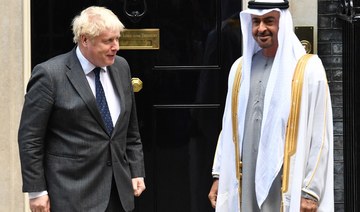 Britain's Prime Minister Boris Johnson (L) greets Crown Prince of Abu Dhabi, Mohamed bin Zayed Al Nahyan on his arrival at No. 10, Downing Street in central London, on September 16, 2021. (AFP)