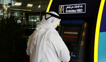 A customer uses an ATM machine at the Emirates NBD head office in Dubai, UAE. (REUTERS file photo)