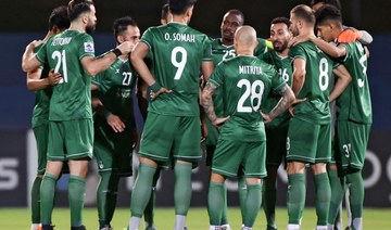 Al-Ahli's players gather in a huddle ahead of their AFC Champions League match against Al-Duhail on April 18, 2021, at the King Abdullah Sport City stadium. (AFP/File Photo)